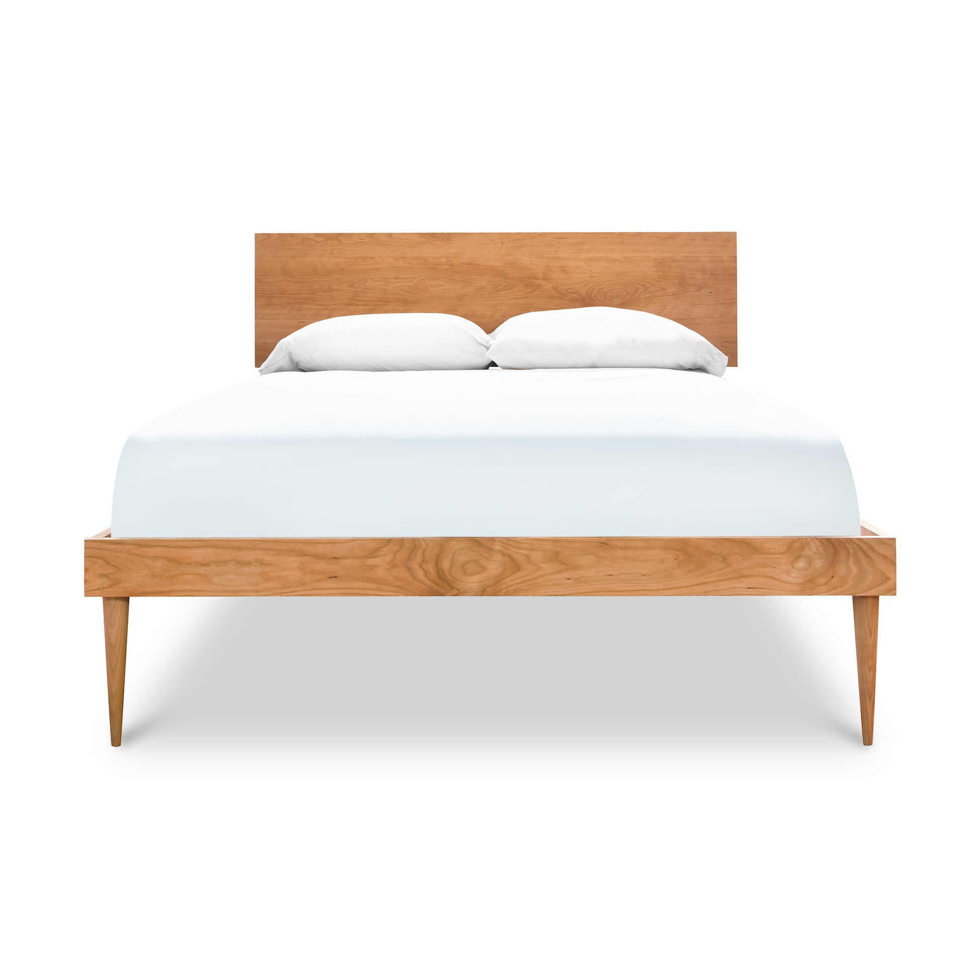 A minimalist, Larssen Bed platform bed frame with a white mattress and two pillows, isolated on a white background.