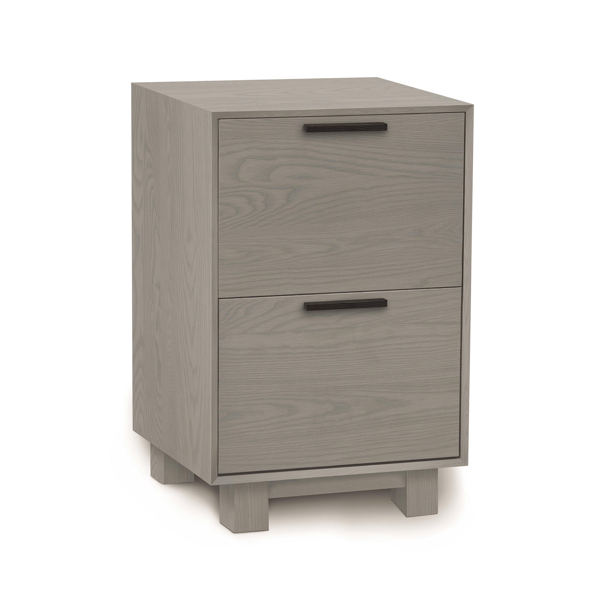 A modern two-drawer natural wood nightstand made from North American hardwoods, Copeland Furniture's Linear Narrow File Cabinet, on a white background.