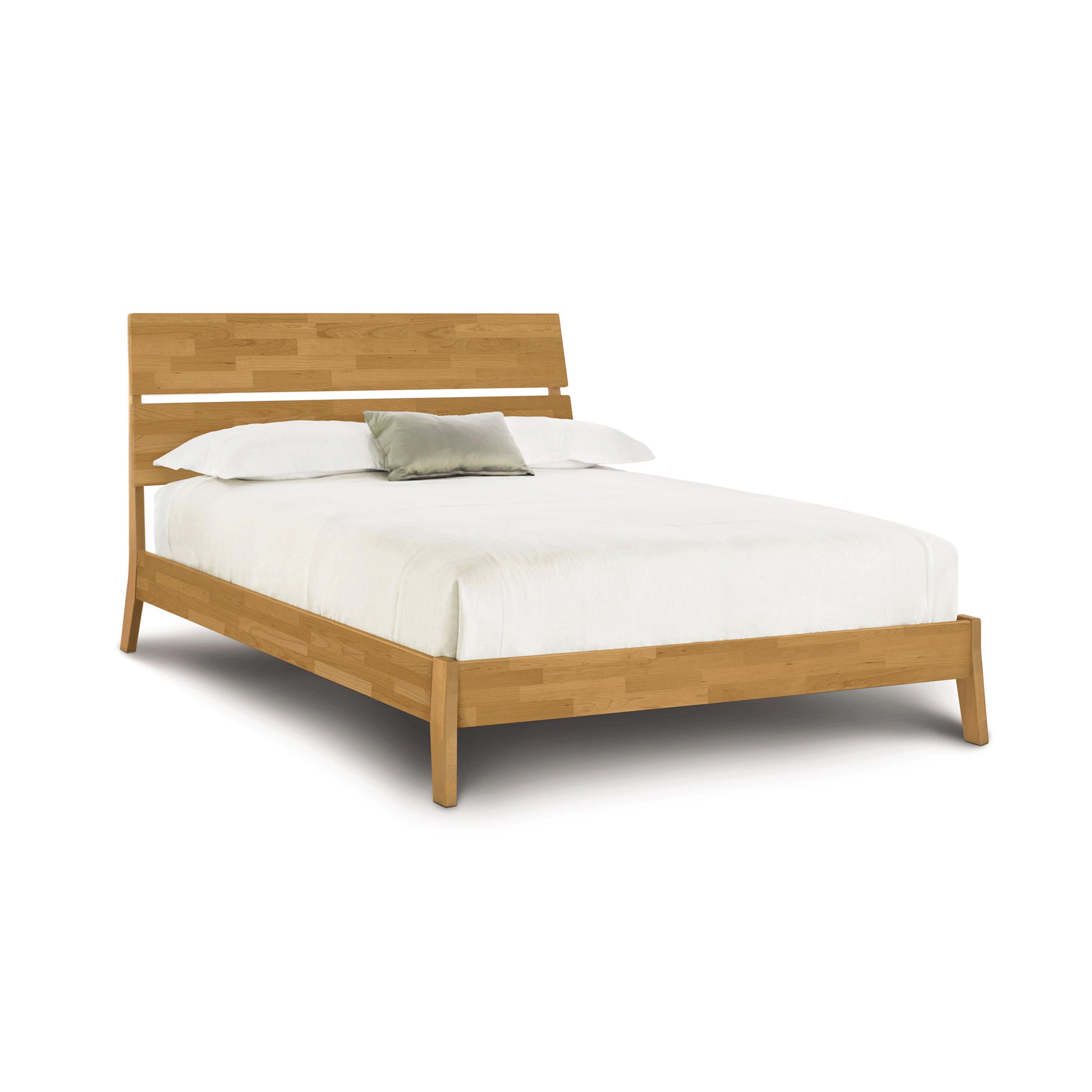 Linn Platform Bed by Copeland Furniture with slatted headboard and upcycled hardwood, showcasing its craftsmanship.