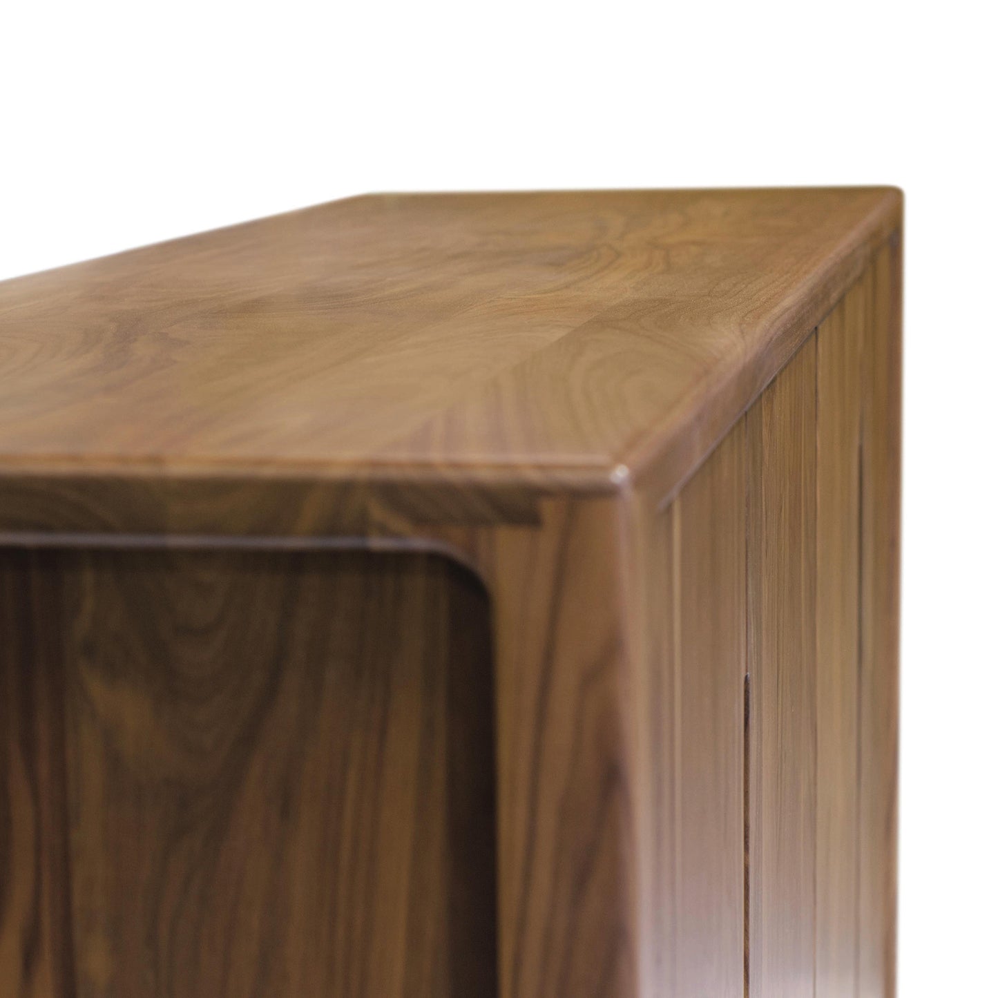 A close-up view of the corner of the Lisse Buffet by Copeland Furniture, showcasing the wood grain details and smooth finish.