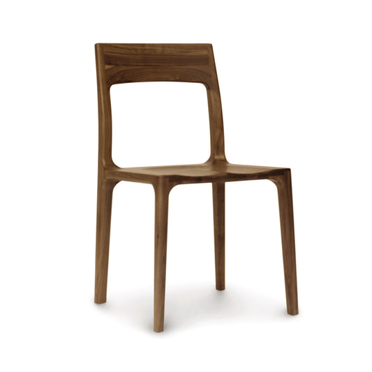 A walnut Lisse Dining Chair with a modern design isolated on a white background, from the Copeland Furniture Collection.