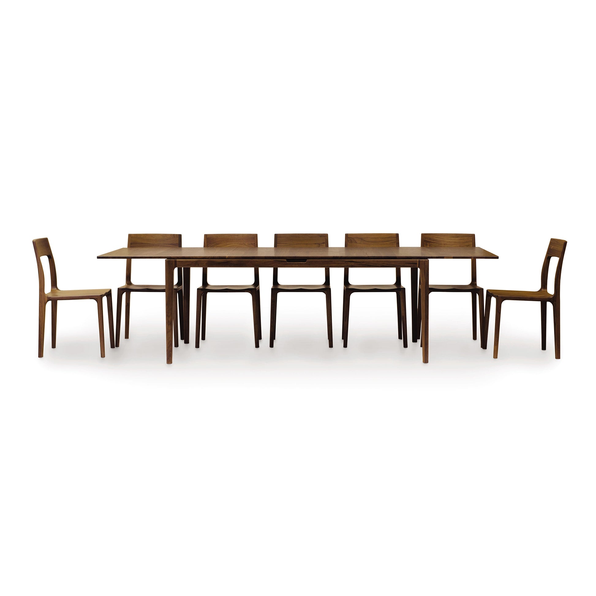 Lisse Extension Dining Table and six matching chairs by Copeland Furniture in sustainable solid walnut.