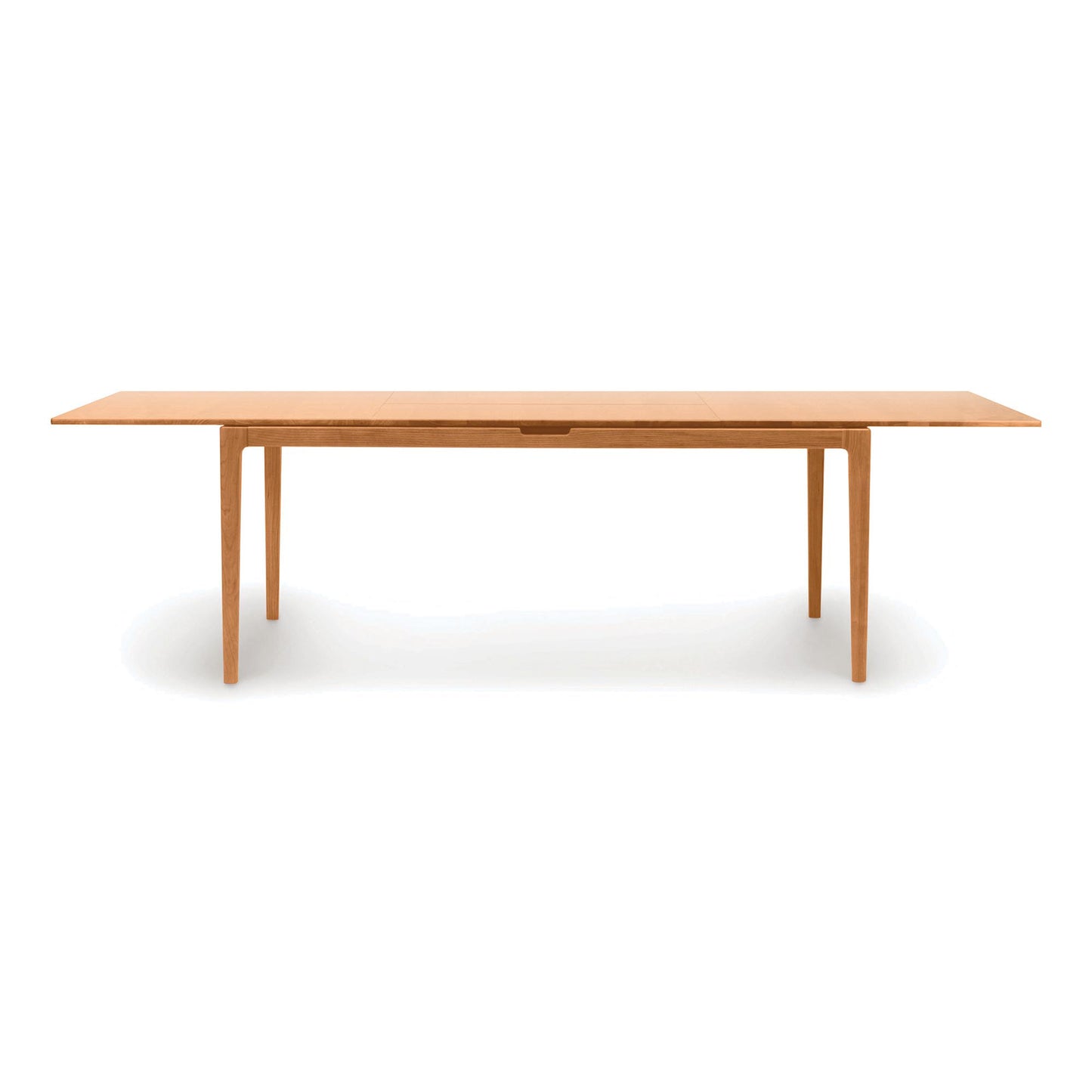 Lisse Extension Dining Table by Copeland Furniture in solid walnut, featuring a rectangular top, clean lines, and four straight legs.