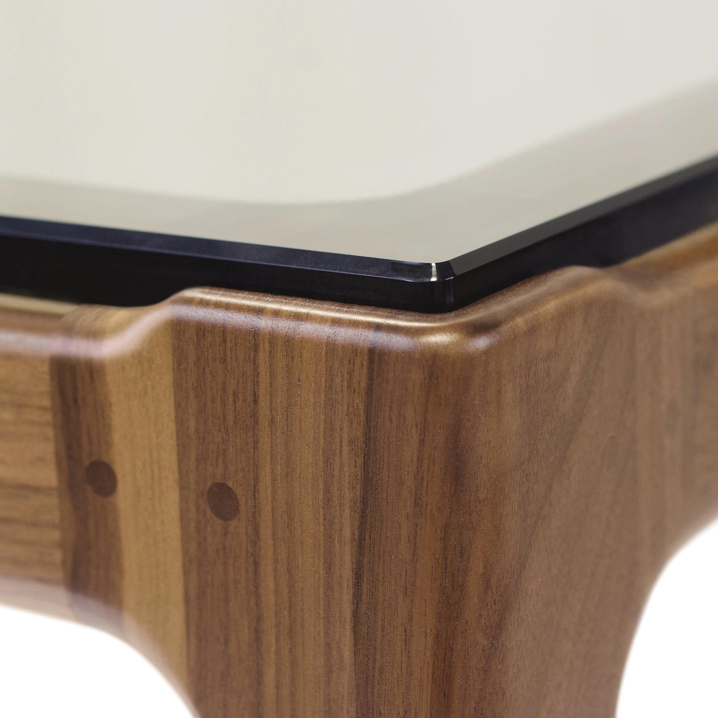 Copeland Furniture Lisse table corner with walnut glass top and minimalist design featuring two round inlaid dots.