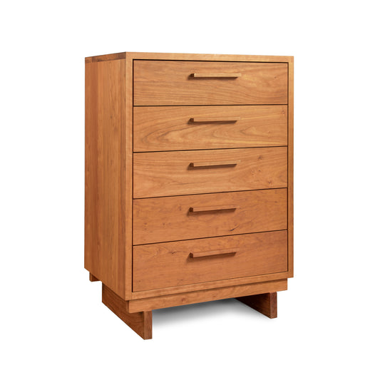 The Vermont Furniture Designs Loft 5-Drawer Chest showcases Vermont craftsmanship with its natural solid hardwood construction. Set against a white background, this wooden chest of drawers exudes timeless beauty and durability.
