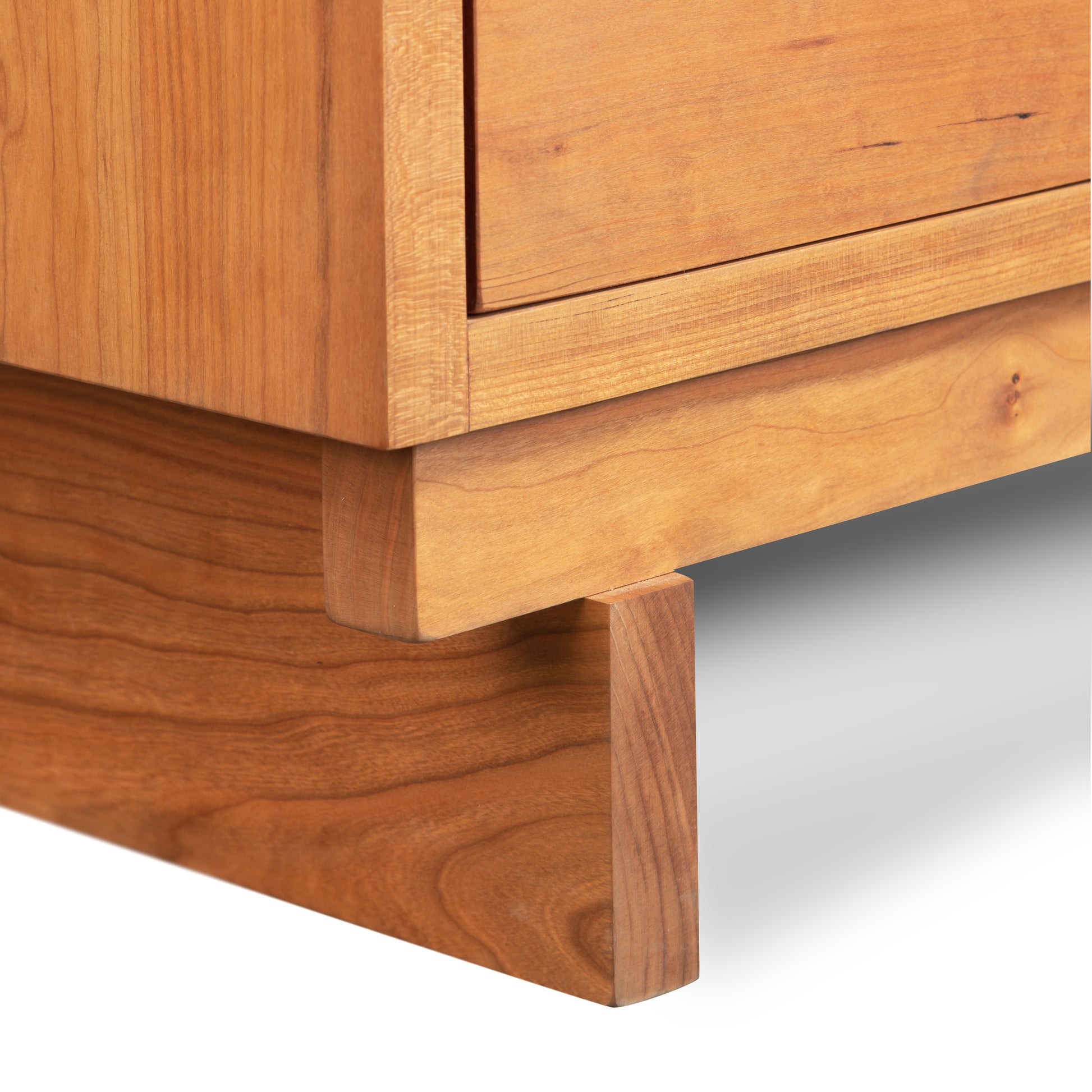 Close-up of a Vermont Furniture Designs Loft 5-Drawer Chest's corner, highlighting the grain patterns of natural solid hardwood and Vermont craftsmanship details.