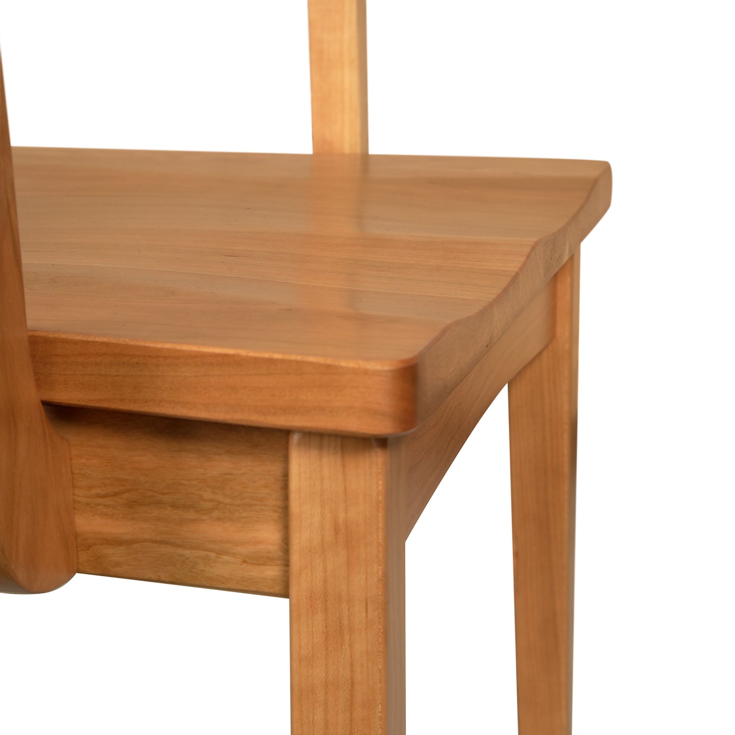 A close up view of a wooden chair.