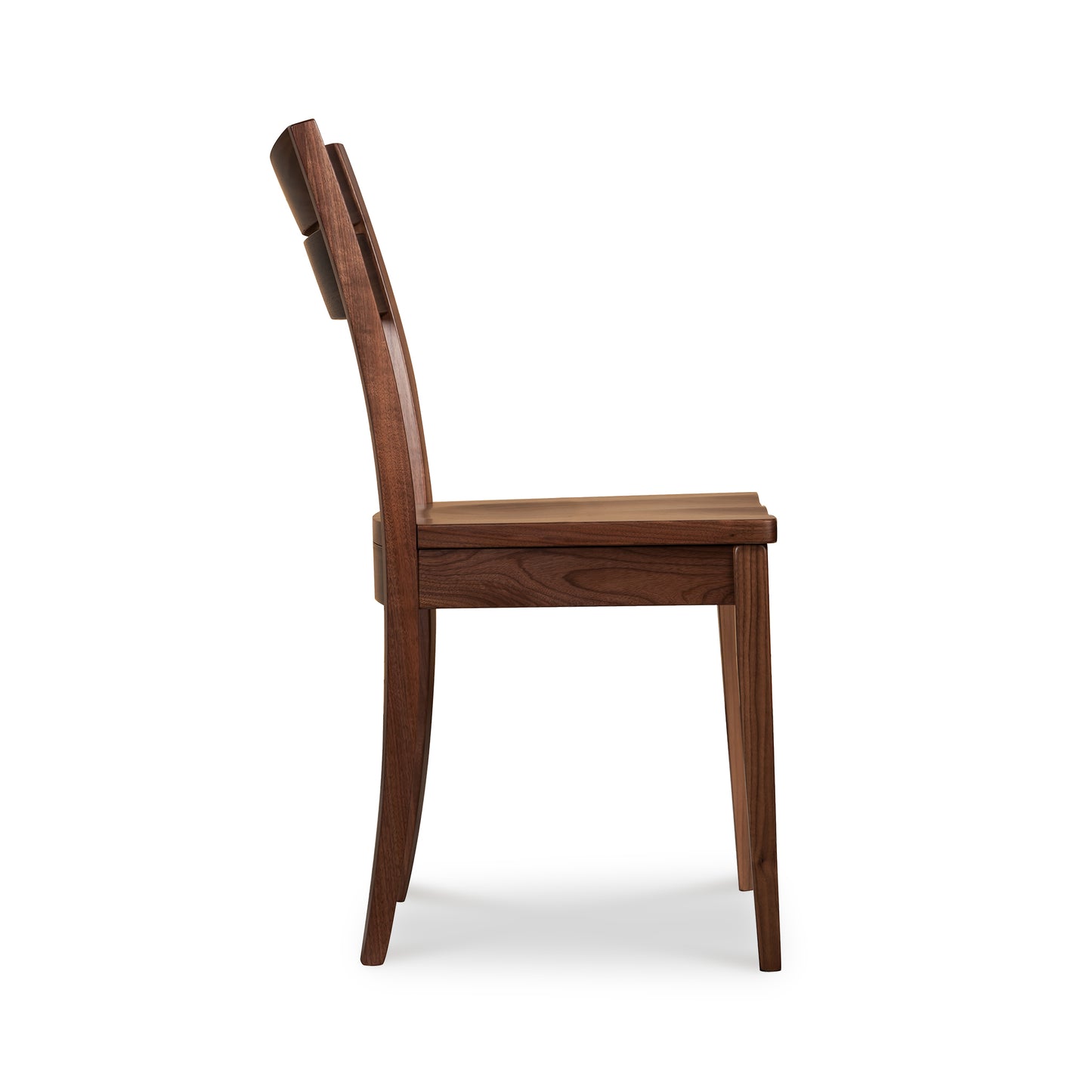 A wooden dining chair on a white background.