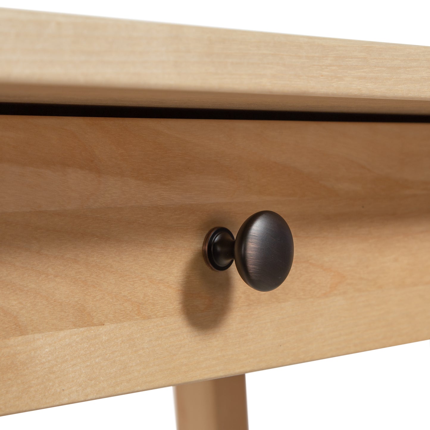 Manchester Birch Writing Desk drawer by Vermont Woods Studios, showcasing fine craftsmanship and a round dark metal knob on solid birch wood.