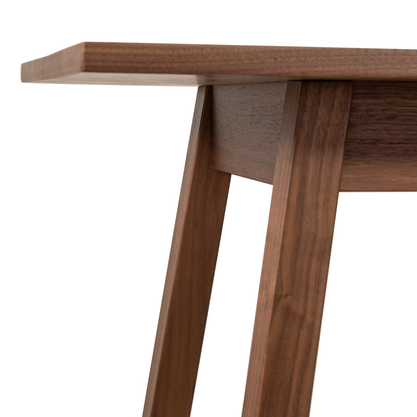A close up of a wooden dining table.