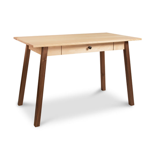 A sustainable Manchester Two-Tone Writing Desk with a natural finish, featuring a single centered drawer and angled legs, isolated on a white background. Brand Name: Vermont Woods Studios