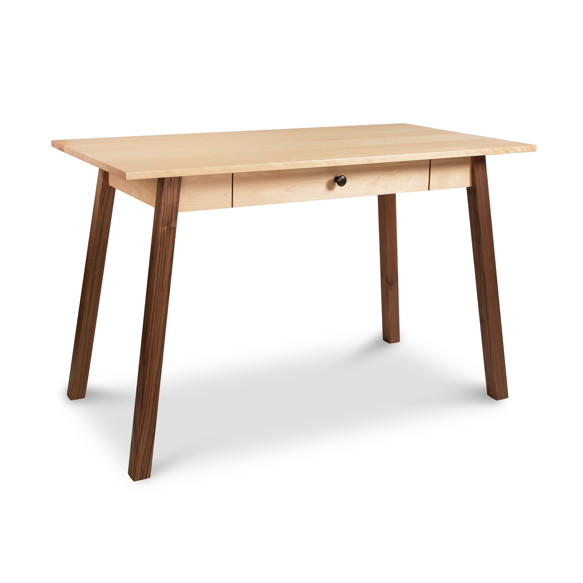 A sustainable Manchester Two-Tone Writing Desk from Vermont Woods Studios with a natural finish featuring a single centered drawer and angled legs, isolated on a white background.