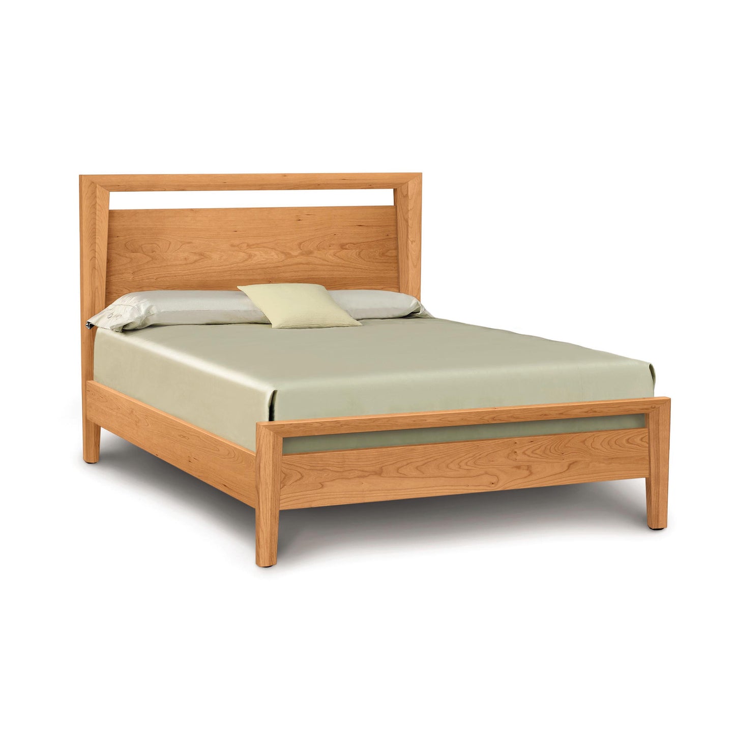 A Mansfield Cherry Platform Bed in the Arts and Crafts style with a simple headboard, complete with a mattress and a plain set of bedding consisting of a fitted sheet, flat sheet, and one pillow. Brand: Copeland Furniture