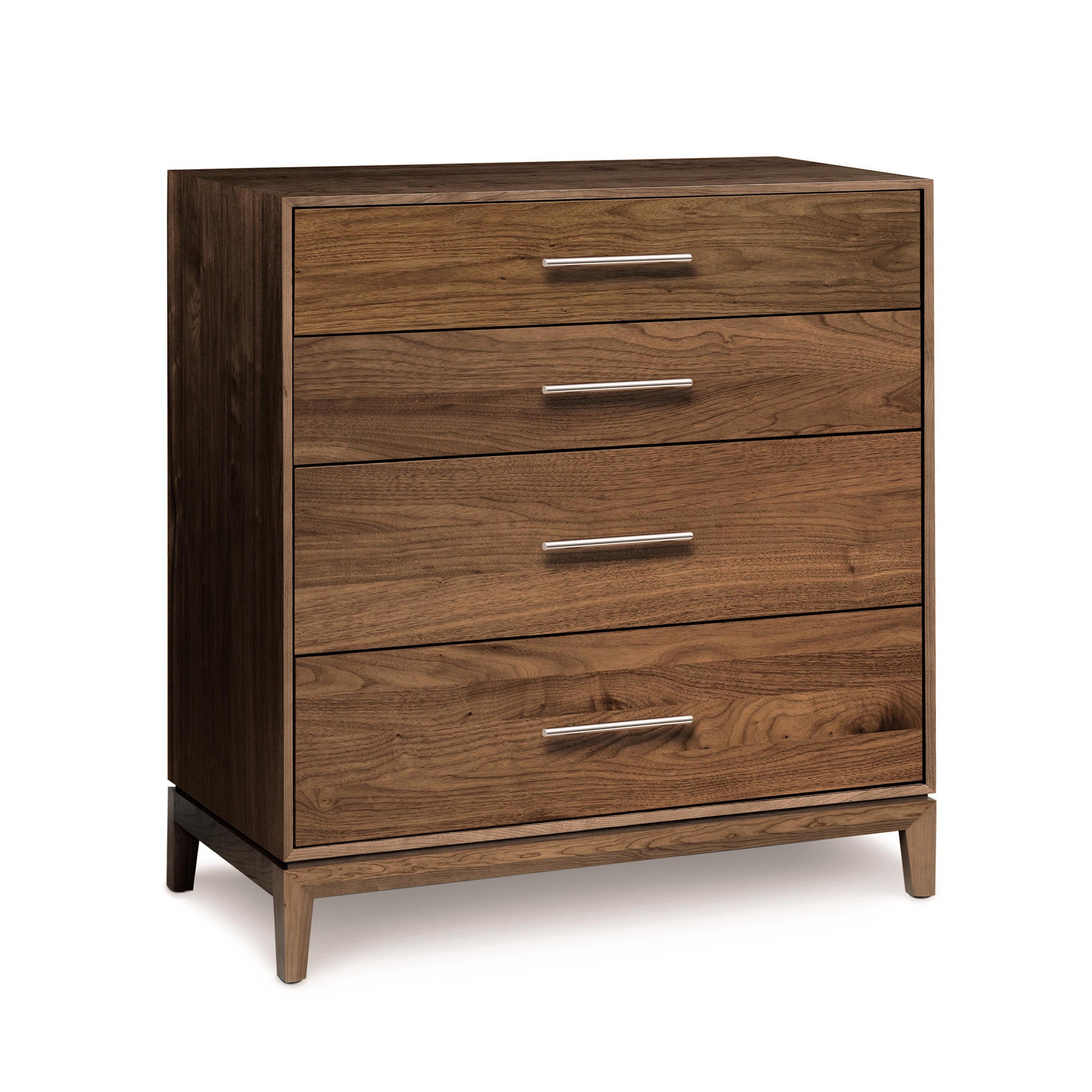 A solid natural wood, Copeland Furniture Mansfield 4-Drawer Chest with metal handles isolated on a white background.