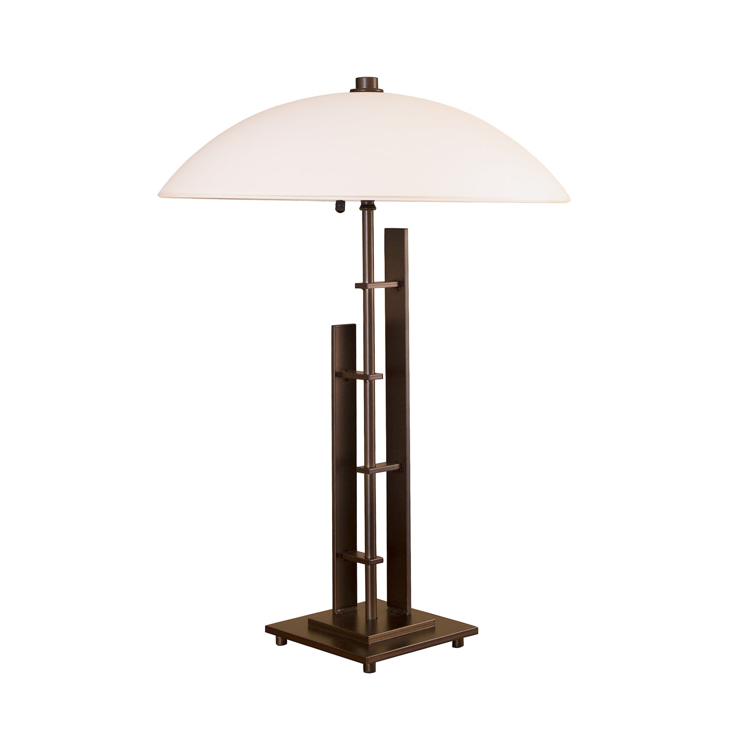 The Metra Double #1 table lamp from Hubbardton Forge features a sleek metal base and is topped with a stylish white shade.