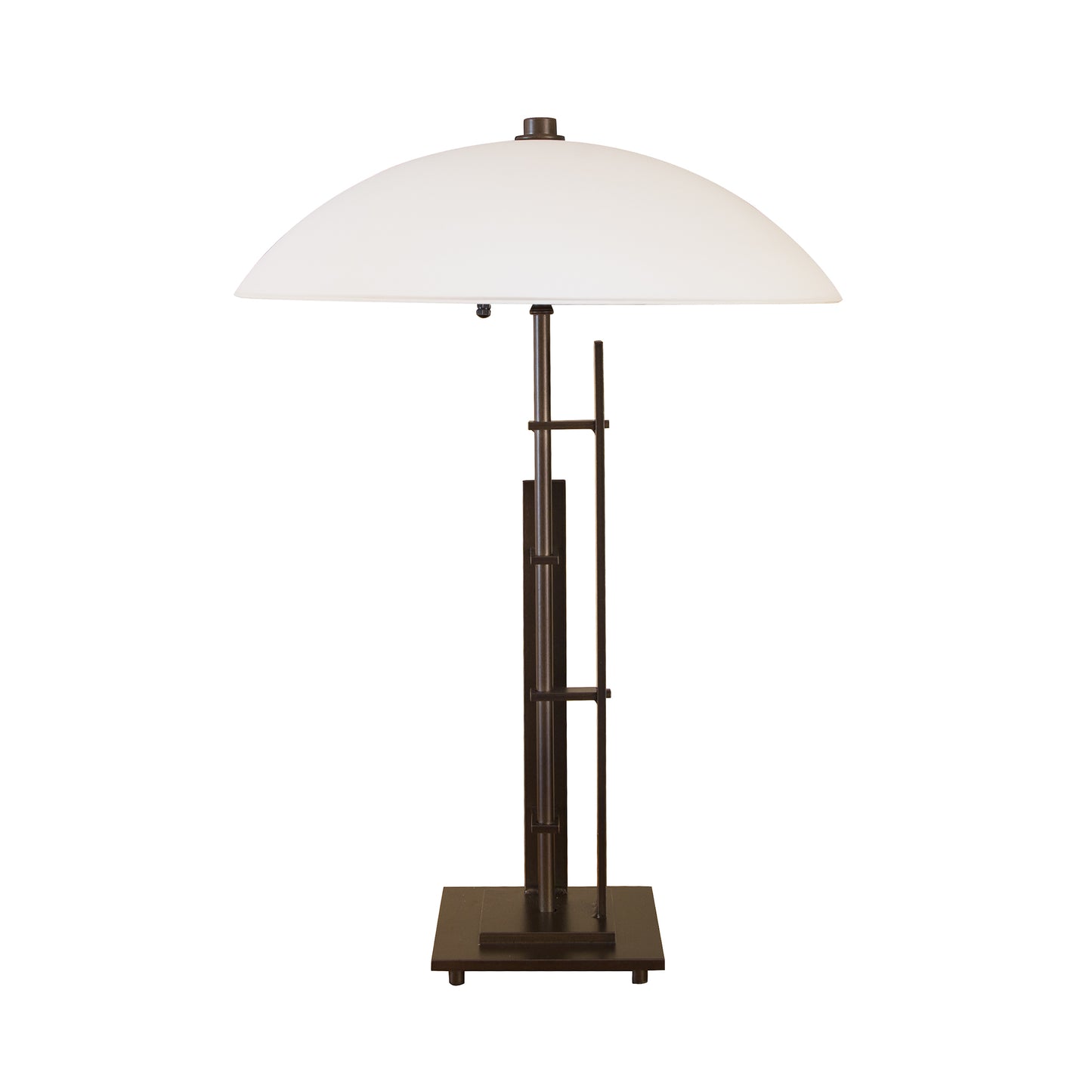 The Metra Double #1 table lamp, handcrafted by Hubbardton Forge, features a white shade on a black base.