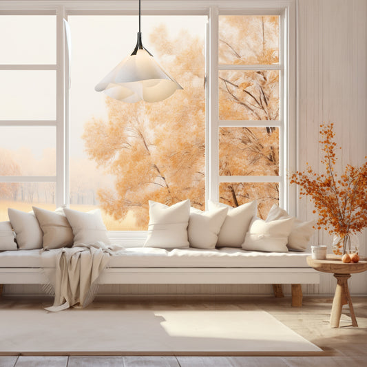 Handcrafted Mobius Large Pendant from Hubbardton Forge hanging above a white sofa, highlighting fine American made living room furniture.