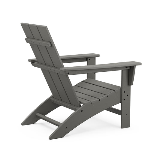 Gray POLYWOOD Modern Adirondack Chair with slatted back and wide armrests, viewed from back and side angle.