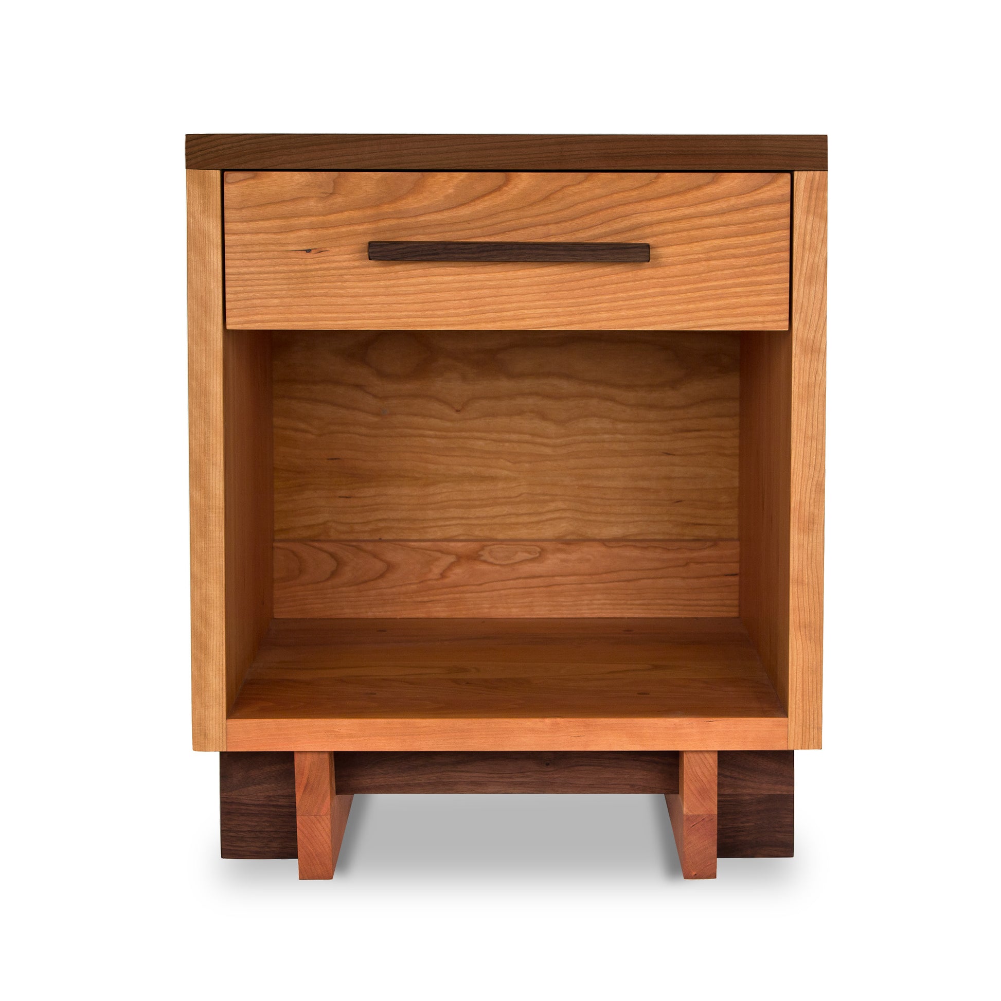 A Modern American 1-Drawer Enclosed Shelf Nightstand by Vermont Furniture Designs, with a single drawer and an open shelf, isolated on a white background. The nightstand features a rich wood grain finish and sturdy, minimalistic design.