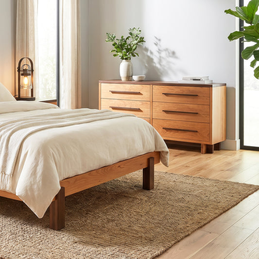 Vermont Furniture Designs Modern American 6-Drawer Dresser and wooden bed featured in a bright bedroom with white bedding.