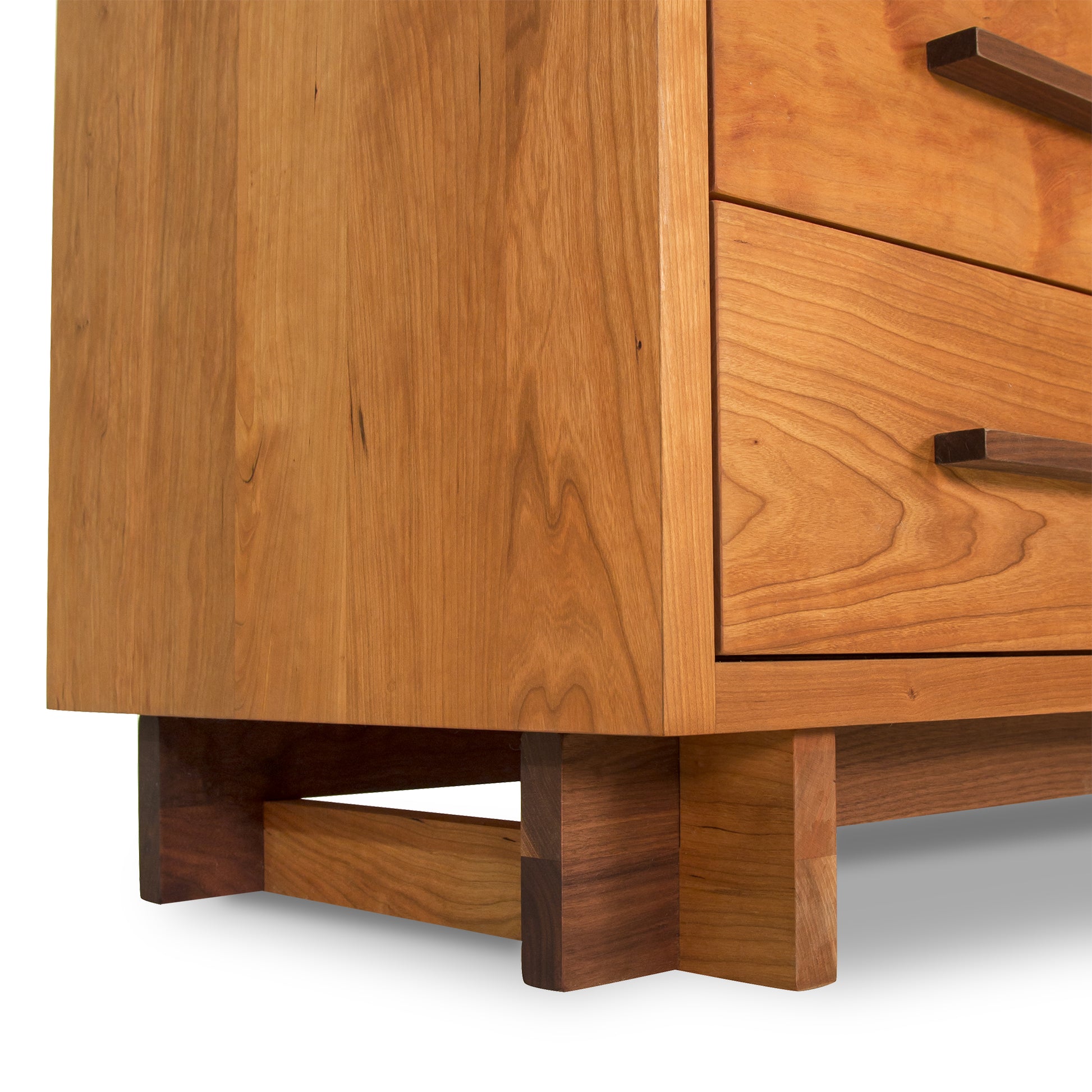 Modern American 8-Drawer Dresser by Vermont Furniture Designs showcasing detailed wood grain, visible drawers, elegant handles, and sturdy legs.