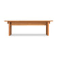 A simple Modern American Bench by Vermont Furniture Designs with a smooth top and sturdy legs on a white background.