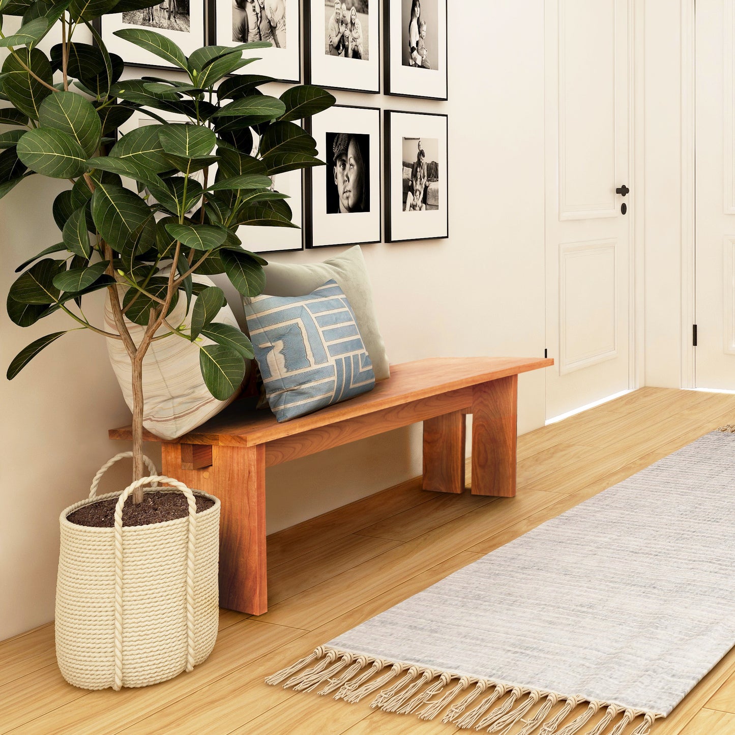 Modern American Bench by Vermont Furniture Designs featuring plush cushions, showcasing its sleek design and craftsmanship in a well-lit interior.