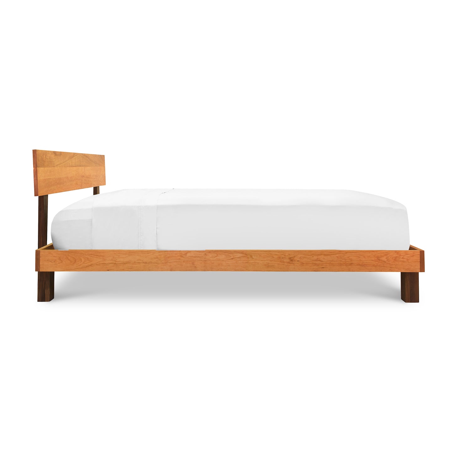 Modern American Platform Bed by Vermont Furniture Designs, crafted from solid hardwoods with a simple headboard and white bedding.