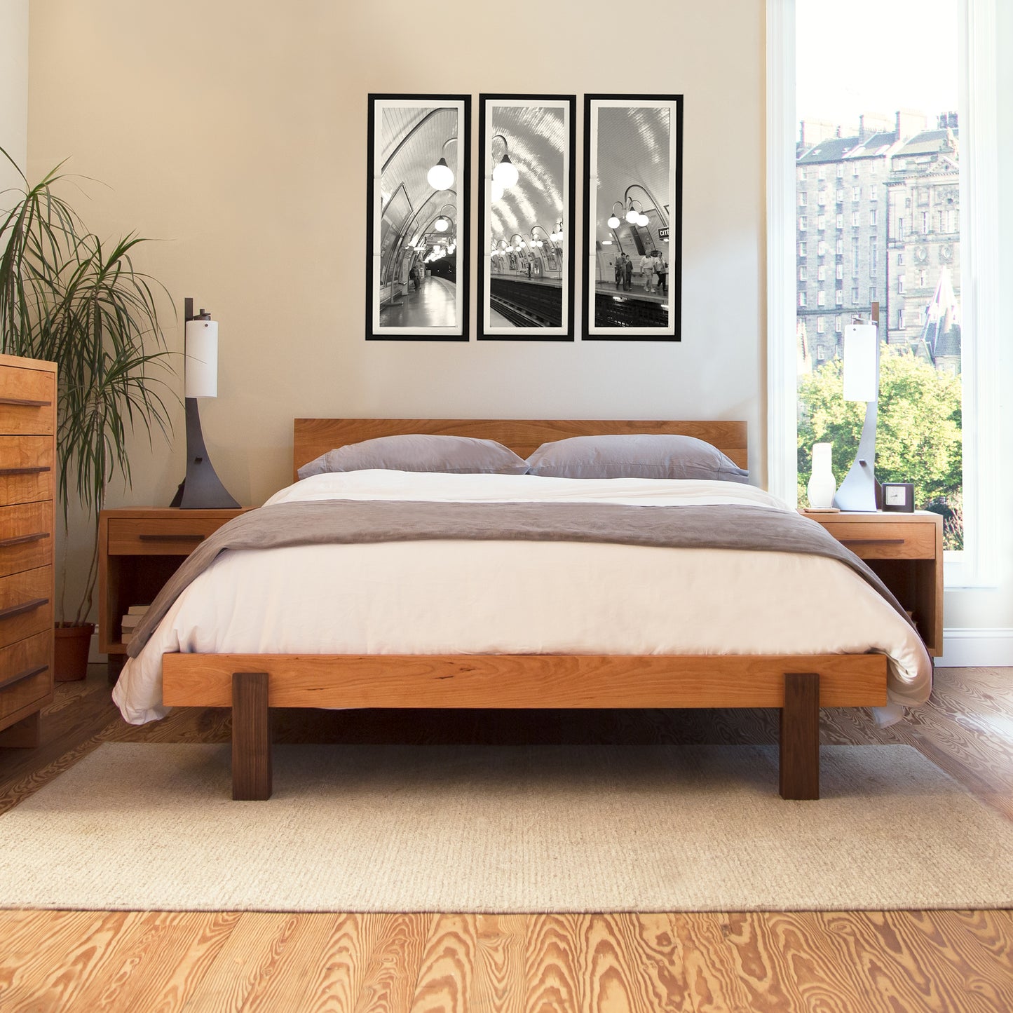 Modern American Platform Bed by Vermont Furniture Designs, flanked by matching bedside tables and a dresser, showcasing high quality craftsmanship and contemporary design.
