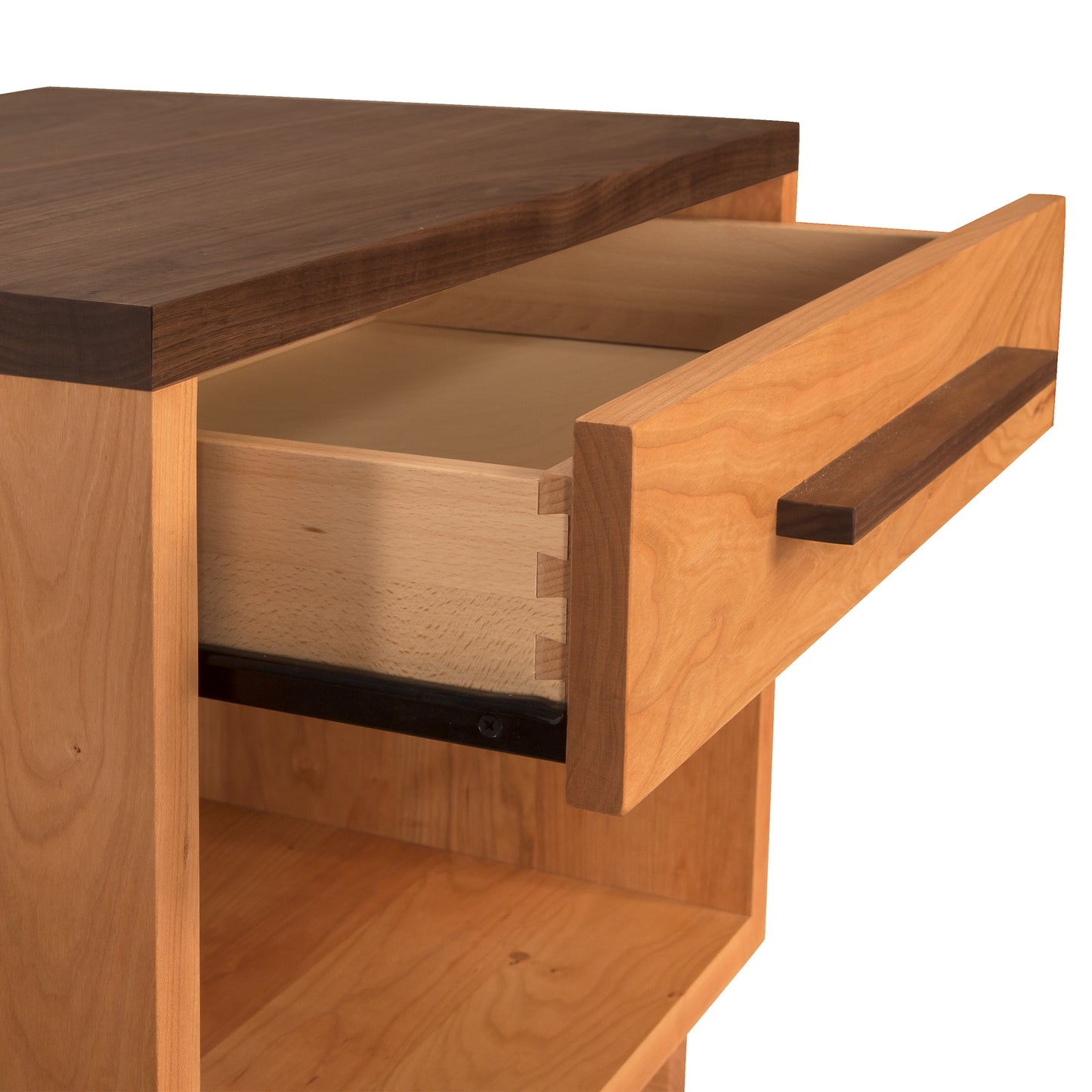 Modern American nightstand by Vermont Furniture Designs with open drawer featuring light wood interior and empty enclosed shelf below.