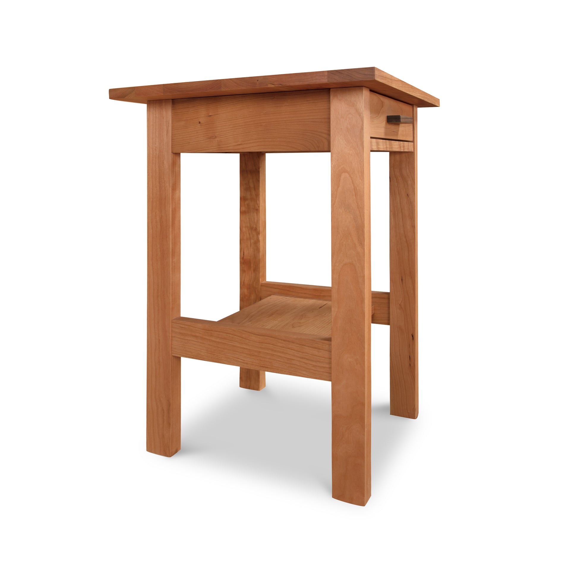 A plain wooden Vermont Furniture Designs Modern Craftsman 1-Drawer Open Shelf Nightstand with a simple design, featuring a flat top, a lower shelf, and straight legs, isolated on a white background.