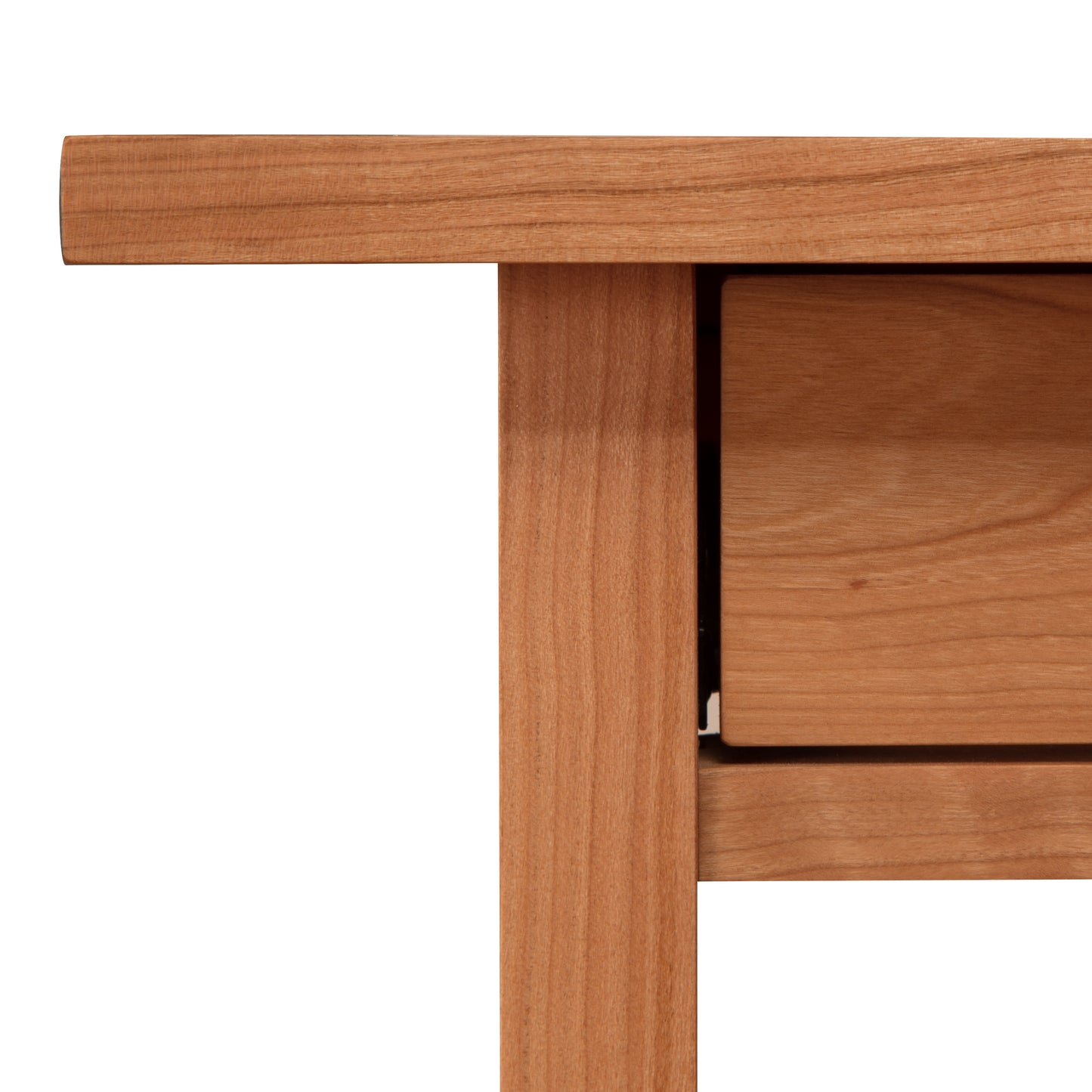 Close-up of a contemporary bedroom's Vermont Furniture Designs Modern Craftsman 1-Drawer Open Shelf Nightstand, showing detail of the natural wood construction at the corner.