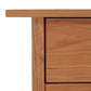Close-up view of a Modern Craftsman 5-Drawer Chest corner, showing wood grain details in a Vermont Furniture Designs style.