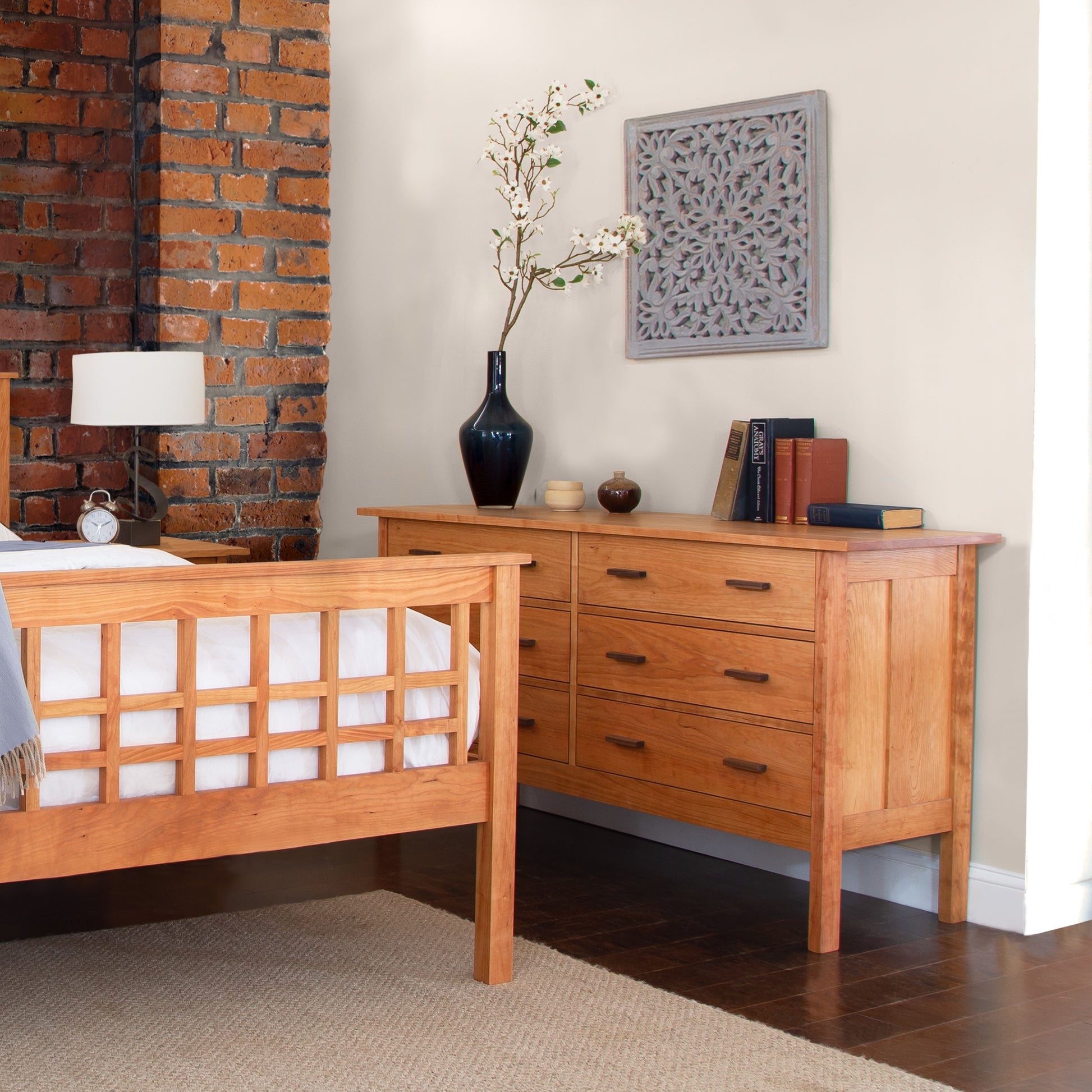 Vermont Furniture Designs Modern Craftsman 6-Drawer Dresser and wooden bed showcasing handcrafted quality and modern style.