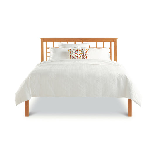 Modern Craftsman Low Footboard Bed by Vermont Furniture Designs in Arts and Crafts style with white bedding and pillows.