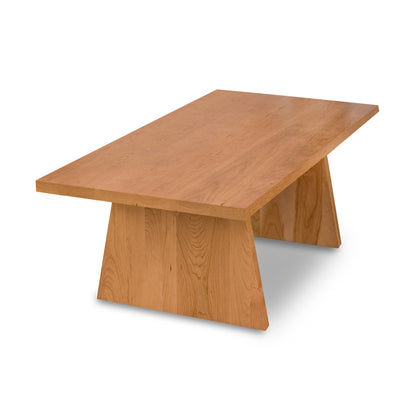 A small Modern Designer coffee table with a square base, manufactured by Lyndon Furniture.