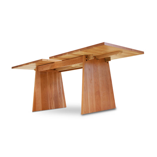 Lyndon Furniture Modern Designer Extension Table with angled legs and extension leaf, crafted in solid wood, displayed against a white background.