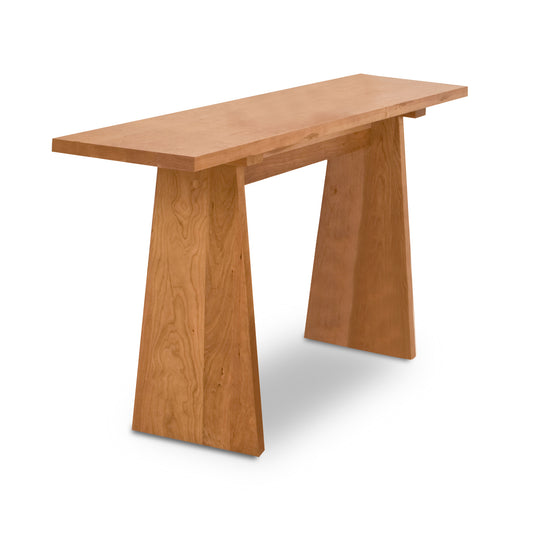 Handcrafted Lyndon Furniture Modern Designer Sofa Table with rectangular wood top and wide, angled legs in a sleek modern design.