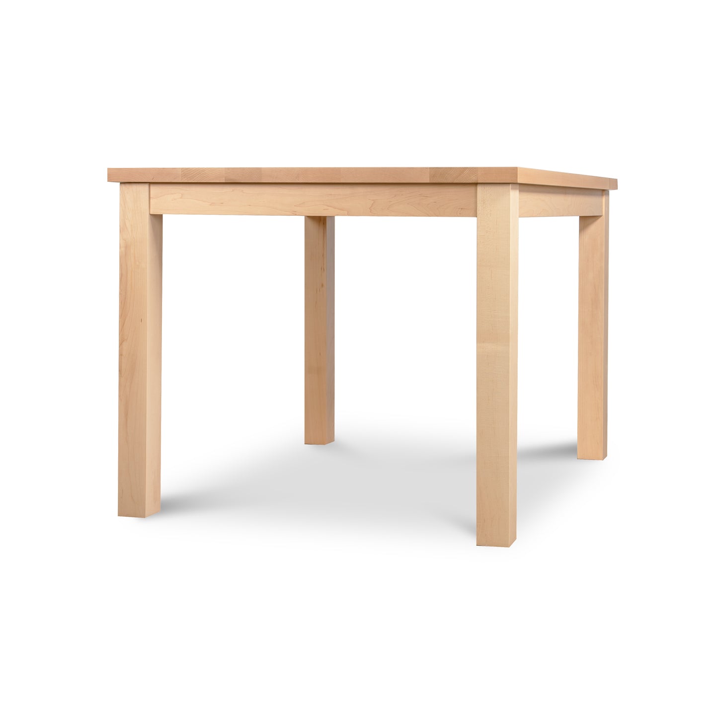A sturdy wooden table with a light natural finish, the Modern Mission Parsons Solid Top Table by Lyndon Furniture features a 36"x48" square top and four straight legs. Handcrafted in Vermont, its simple and functional design is also eco-friendly.