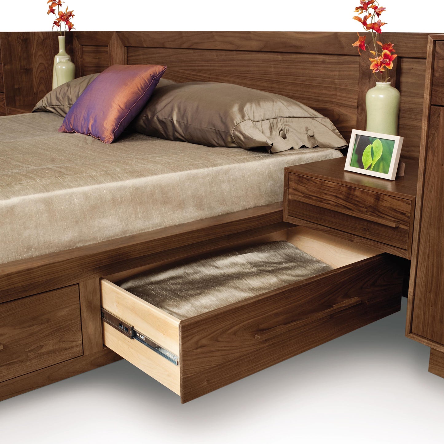 Vermont handmade wooden bed and bedside table by Copeland Furniture with drawer, highlighting craftsmanship.