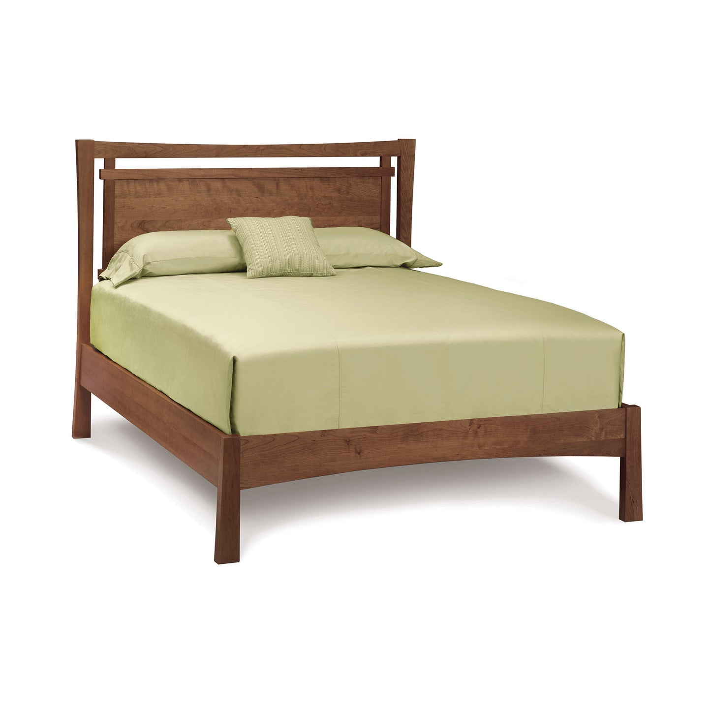 An eco-friendly Monterey Platform Bed frame with a matching headboard, dressed with a pale green bed sheet set and two pillows in a room with a white background.