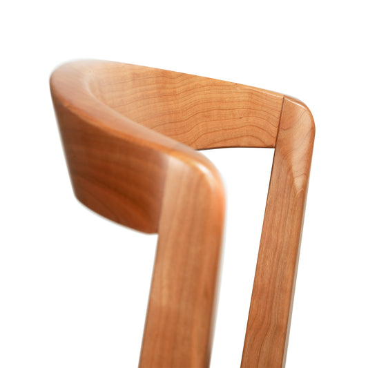 Vermont Woods Studios Montgomery Chair featuring elegant cherry wood curves and Barley Upholstery, showcasing fine American craftsmanship.