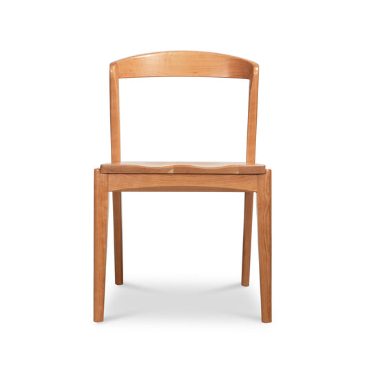 Montgomery Chair with Wood Seat by Vermont Woods Studios, front view, highlighting its curved backrest and flat wood seat.