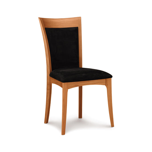 A Copeland Furniture Morgan Shaker Chair with a black upholstered seat and a curved backrest, isolated on a white background.