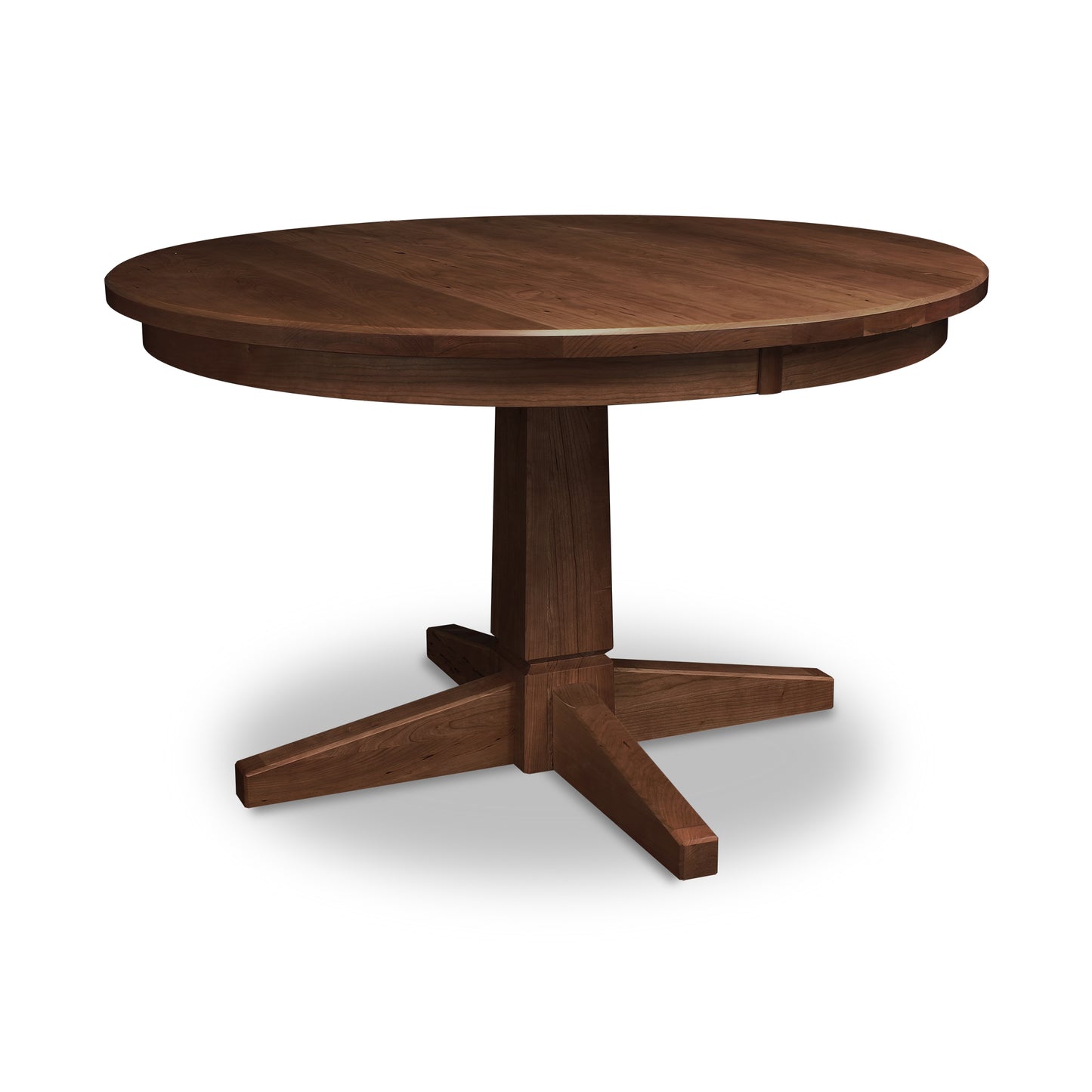 Lyndon Furniture Natural Vermont Single Pedestal Round Solid Top Table featuring four angled legs and a smooth wooden finish.