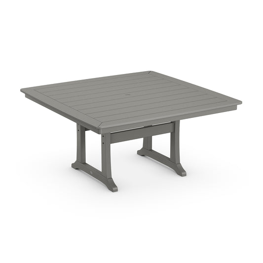 A square, grey POLYWOOD® Nautical Trestle 59" Dining Table with a slatted top and sturdy legs, positioned on a plain white background.