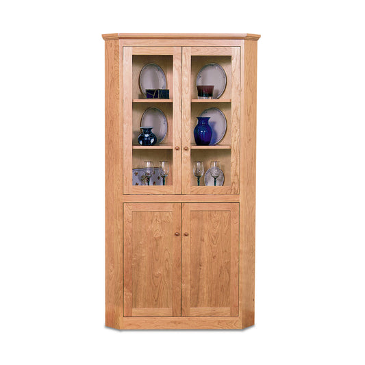 Lyndon Furniture New England Shaker Corner Cabinet with upper glass display doors and lower solid wood doors, handcrafted in classic Shaker style.