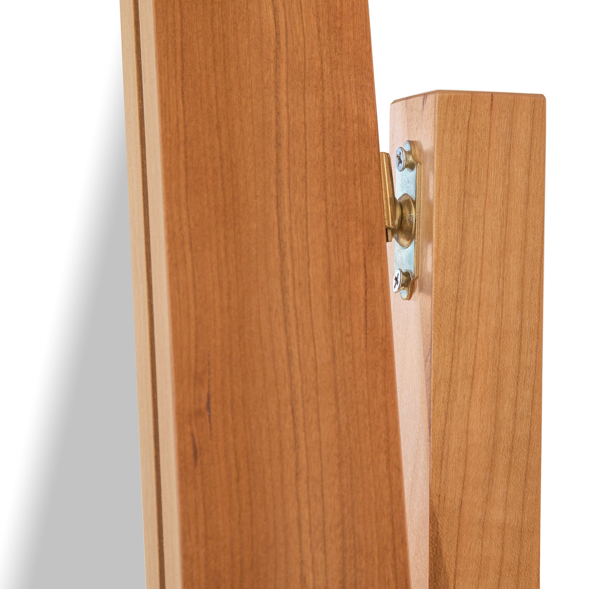 Detail of solid hardwood joint and brass hinge on the Lyndon Furniture New England Shaker Floor Mirror, highlighting quality craftsmanship.