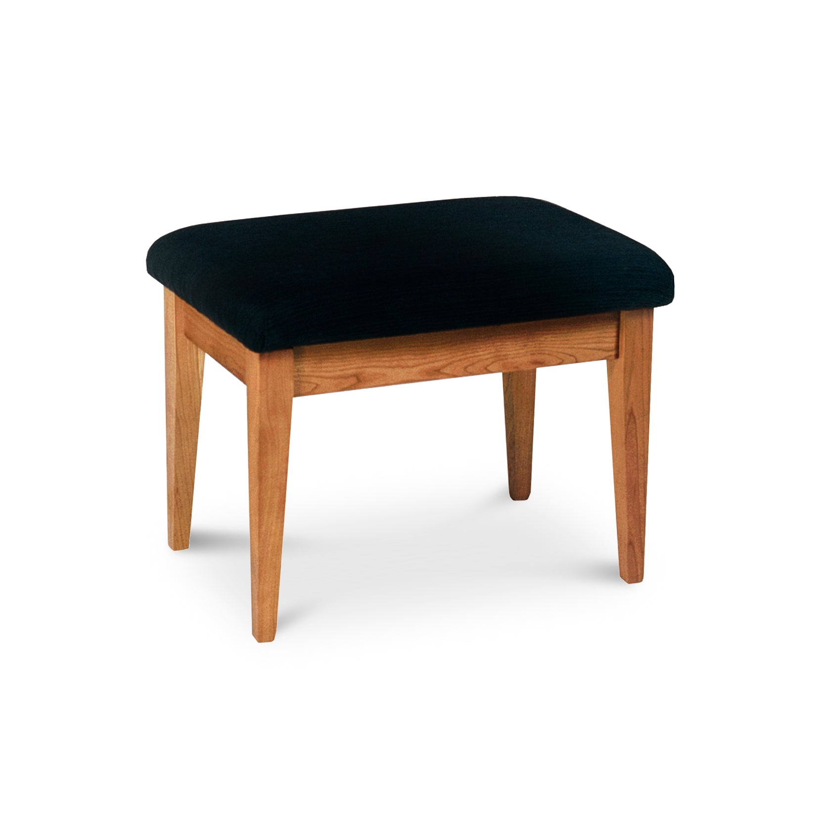 A New England Shaker Dressing Stool by Lyndon Furniture, with a black upholstered seat, sustainably harvested wood.