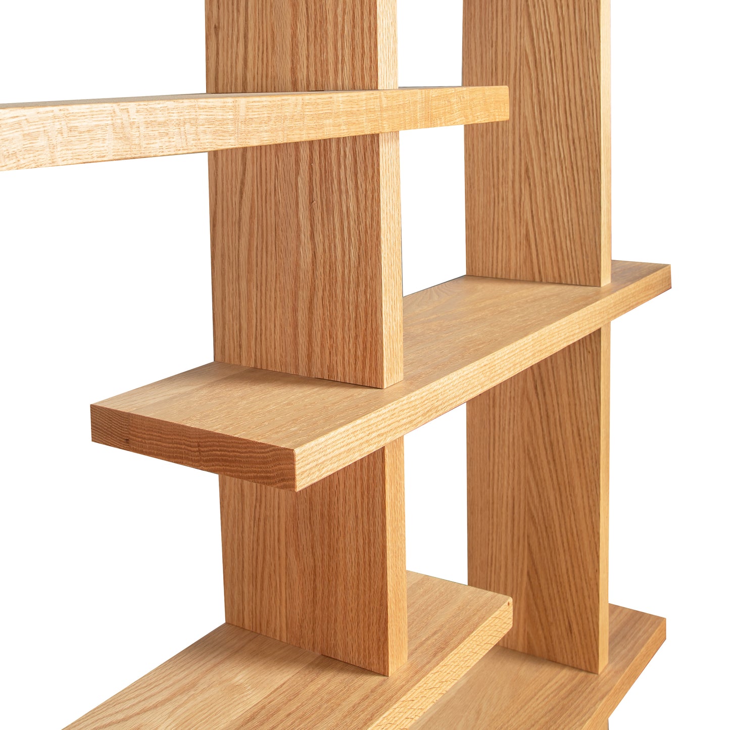 Lyndon Furniture's New York Contemporary Bookcase features modern intersecting shelves crafted from sustainably harvested wood, showcasing elegant design and craftsmanship.